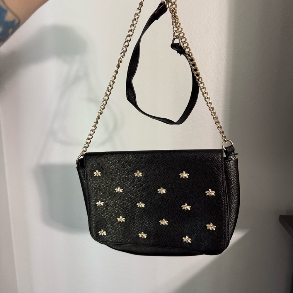 Francesca’s black crossbody with gold bee accents
